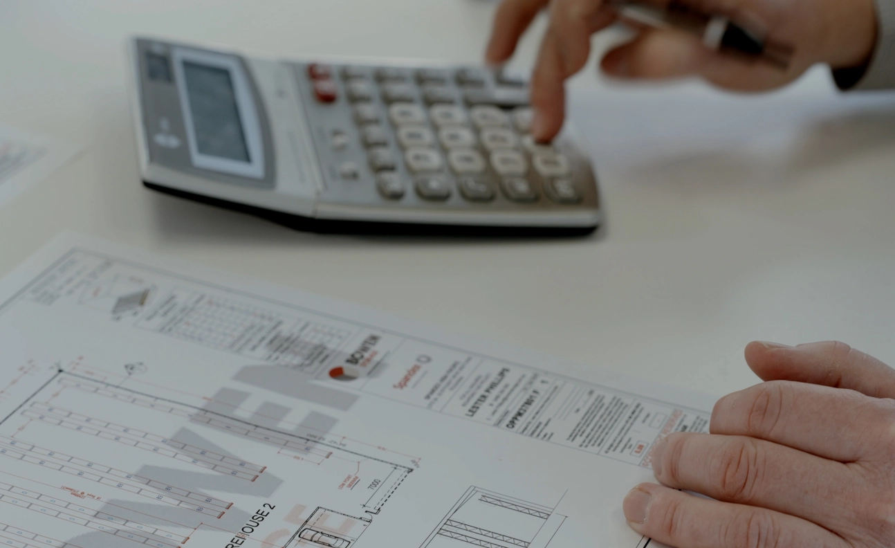 Planner calculating warehouse layout measurements for material handling flow optimisation